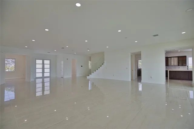 an empty room with windows and pillars in it