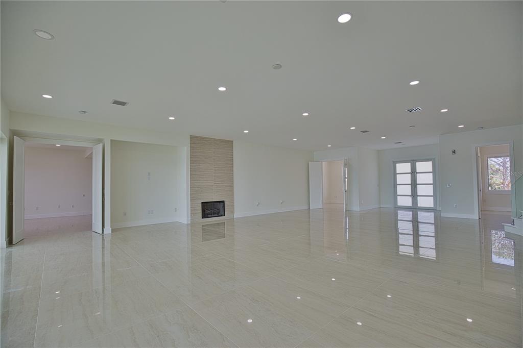 13064 Via Flavia Placida, FL 33946 - Photo 16 of 75 an empty room with windows and pillars in it