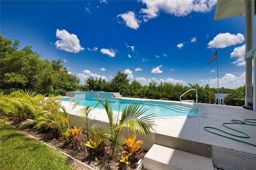 13064 Via Flavia Placida, FL 33946 - Photo 2 of 75 a view of a swimming pool with a patio and plants