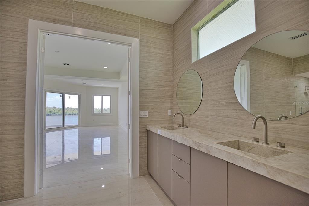 13064 Via Flavia Placida, FL 33946 - Photo 24 of 75 a bathroom with a double vanity sink and a mirror