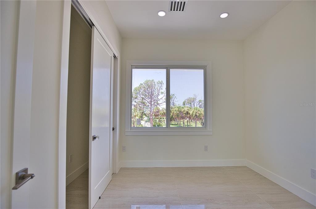 13064 Via Flavia Placida, FL 33946 - Photo 28 of 75 an empty room with windows