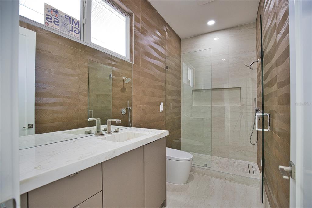 13064 Via Flavia Placida, FL 33946 - Photo 32 of 75 a bathroom with a sink a toilet and shower