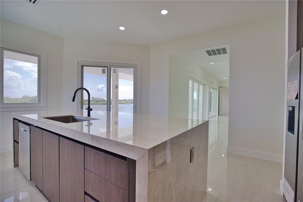 13064 Via Flavia Placida, FL 33946 - Photo 39 of 75 a kitchen with a sink and cabinets