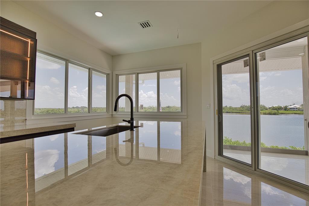 13064 Via Flavia Placida, FL 33946 - Photo 44 of 75 a view of a kitchen with a sink and a large window