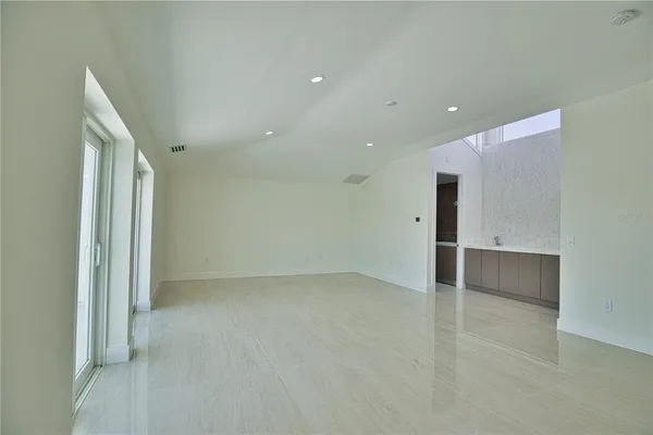 a view of an empty room with a window