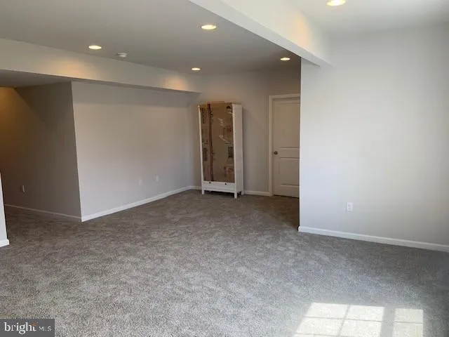 a view of a big room with windows