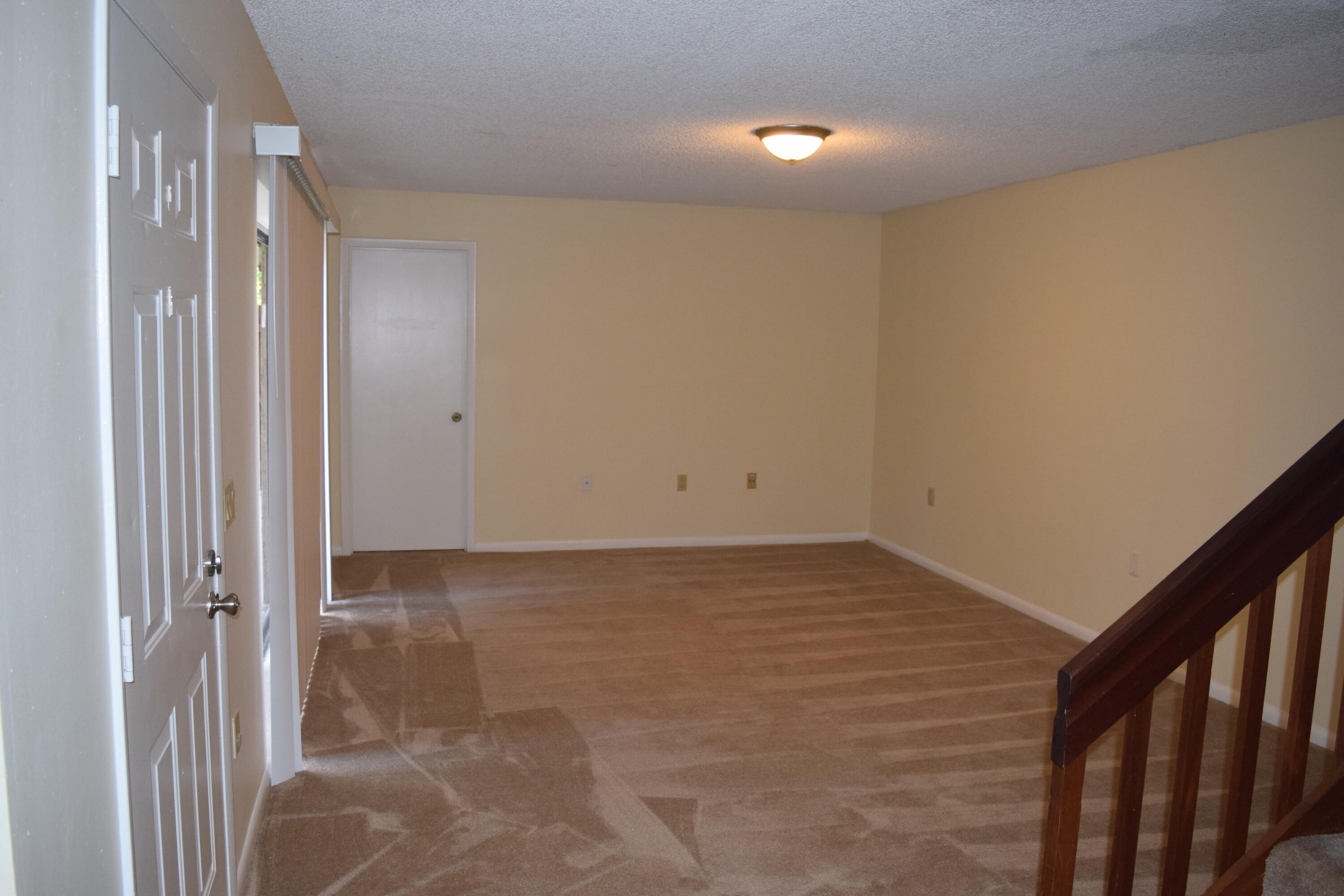 5945 Southeast Windsong Lane, Unit 907 Stuart, FL 34997 - Photo 7 of 34 a view of an empty room
