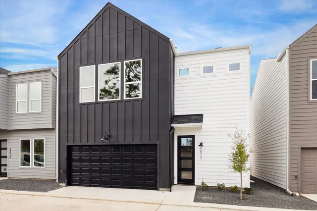 a front view of a house with a garage