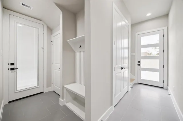 a kitchen with kitchen island granite countertop a sink a stove oven a counter top space and cabinets