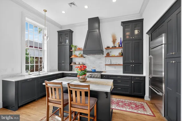 a dining room with furniture and window