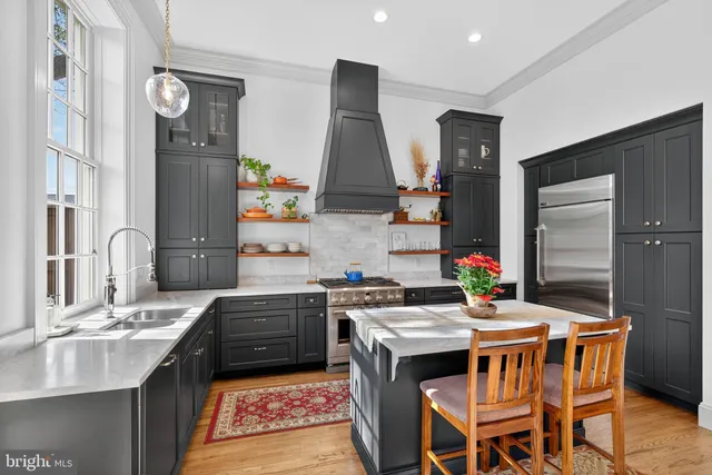 a kitchen with a sink stove and refrigerator