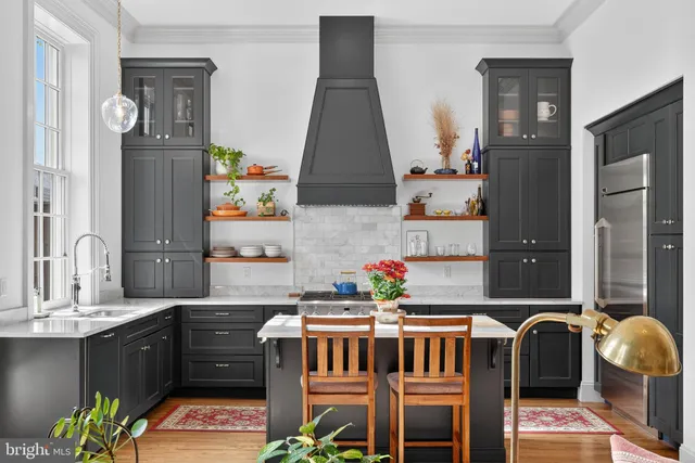 a kitchen with a sink cabinets and window