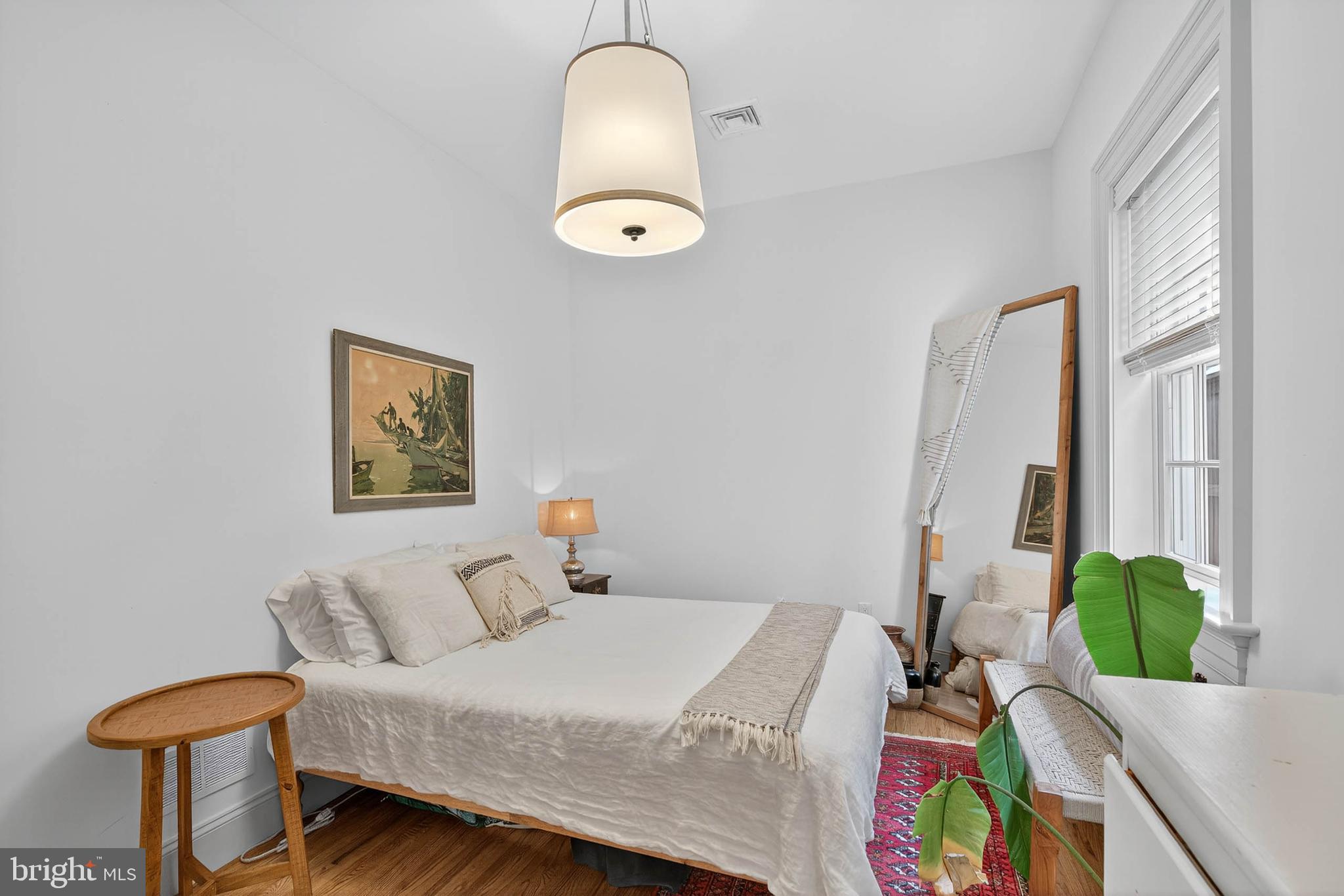 14 East Farnum Street Lancaster, PA 17602 - Photo 32 of 50 a bedroom with a bed and a chandelier