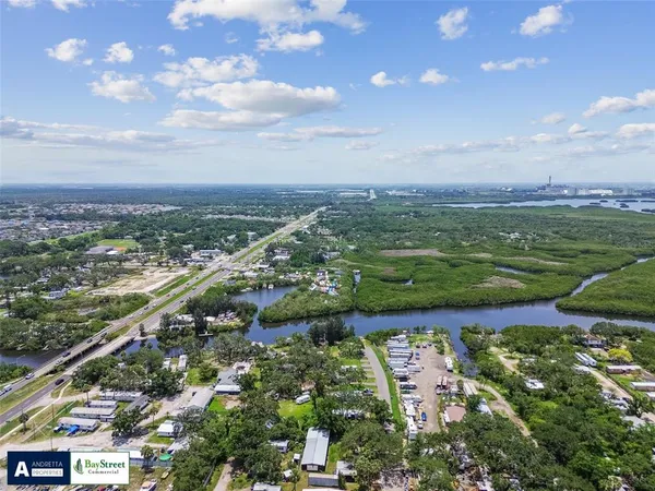 an aerial view of city and lake
