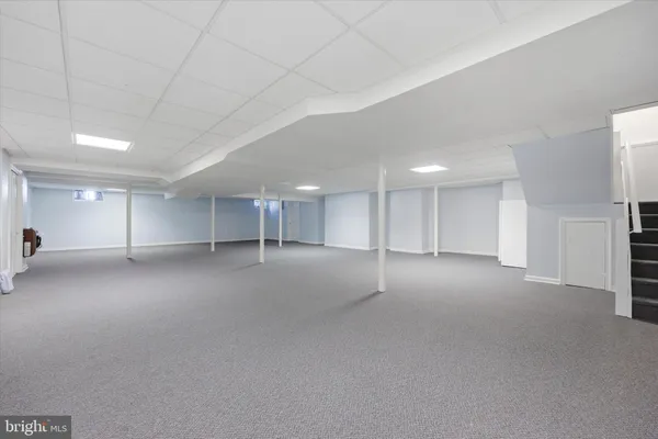 a room with furniture and a large window