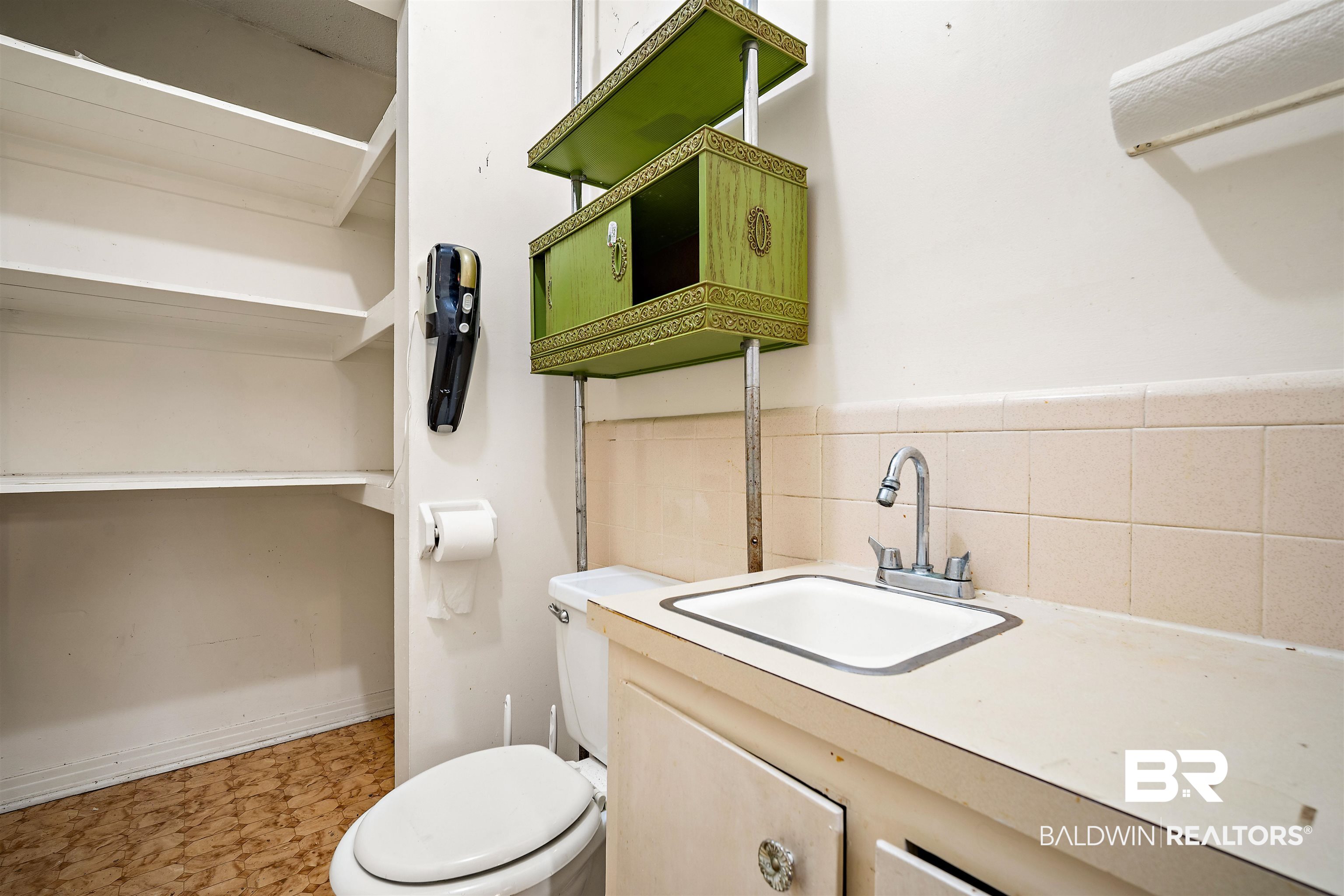 5559 Woodside Drive North Mobile, AL 36608 - Photo 7 of 28 Bathroom featuring vanity and tile walls