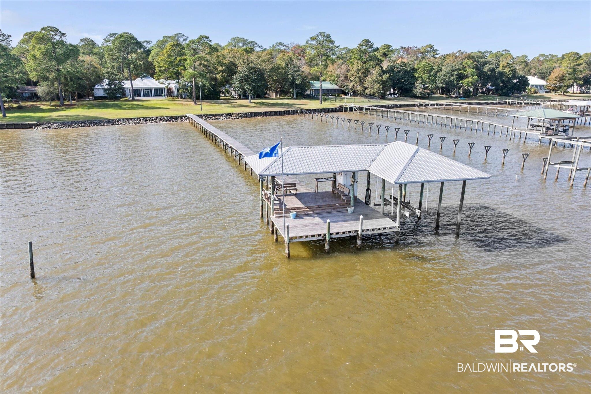 7015 Bay Road Mobile, AL 36605 - Photo 41 of 53 Dock with boat lift, view of scattered trees, and a water view