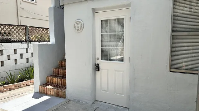 a view of a door and chair in the room