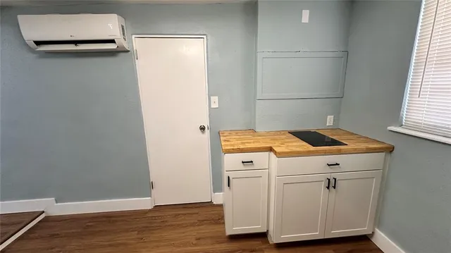 a stove top oven sitting inside of a kitchen