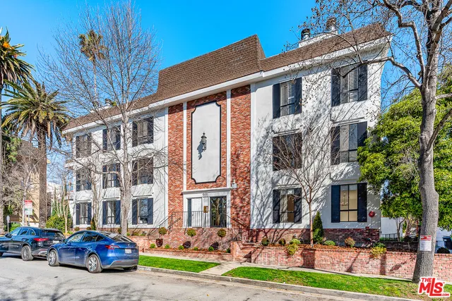 a front view of a building with garden