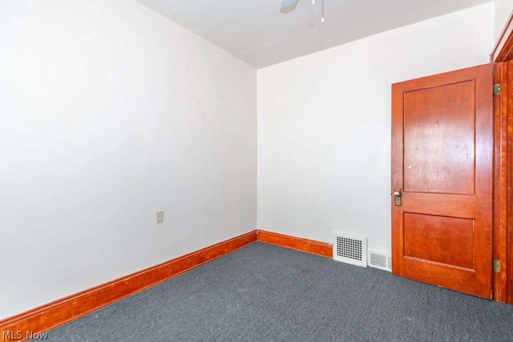 917 Helmsdale Road Cleveland Heights, OH 44112 - Photo 23 of 28 Carpeted empty room featuring baseboards