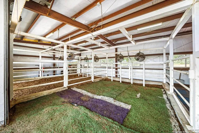 a view of a patio with table and chairs