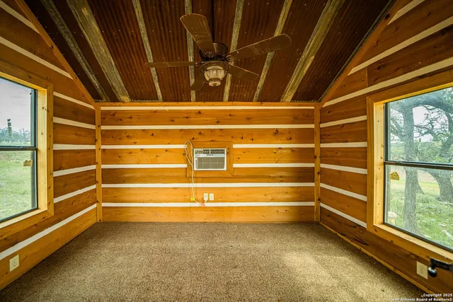 a view of a backyard with sitting area