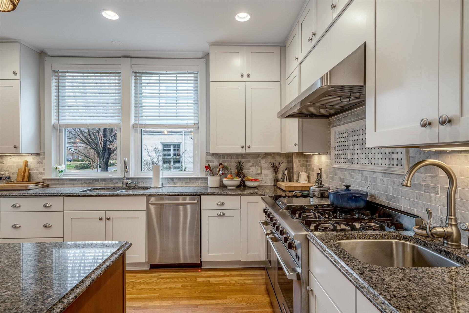 400 High Street Salem, VA 24153 - Photo 21 of 67 a kitchen with stainless steel appliances granite countertop a sink stove and cabinets