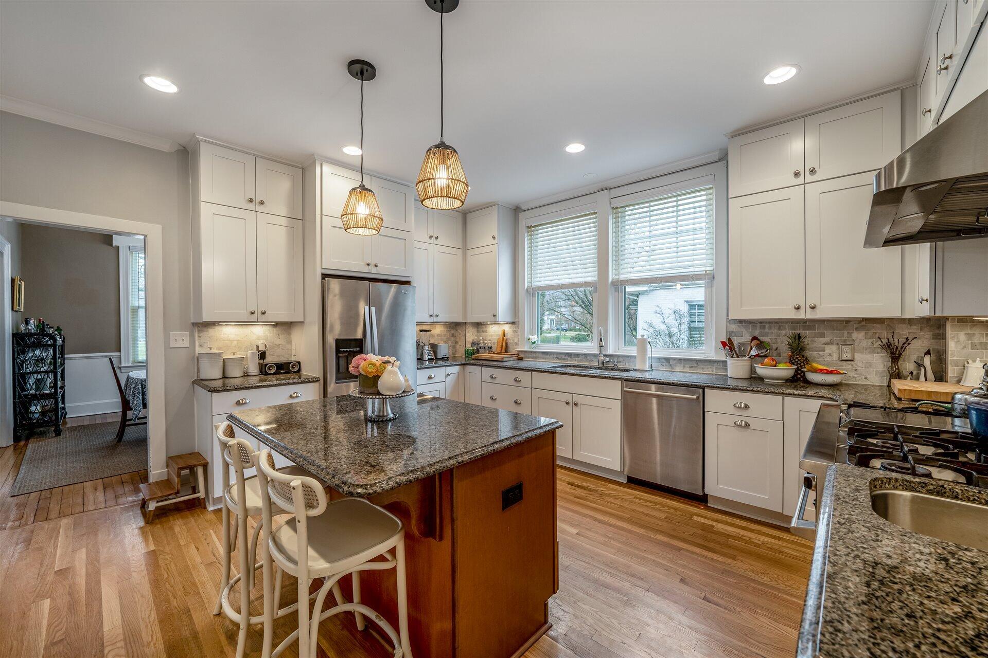 400 High Street Salem, VA 24153 - Photo 22 of 67 a kitchen with stainless steel appliances granite countertop a stove top oven a refrigerator a sink and white cabinets with wooden floor