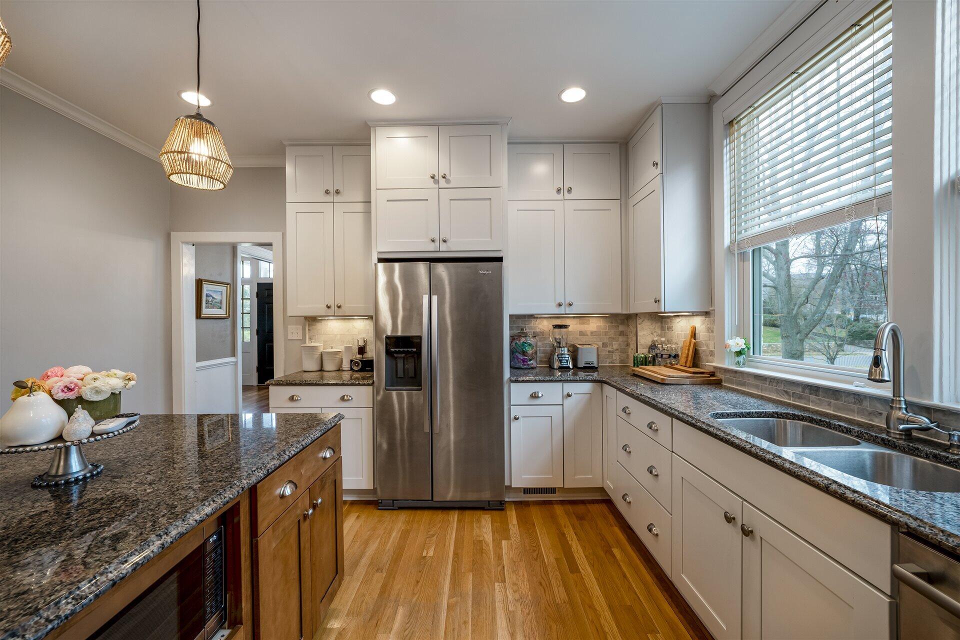 400 High Street Salem, VA 24153 - Photo 23 of 67 a kitchen with stainless steel appliances granite countertop a sink refrigerator and cabinets