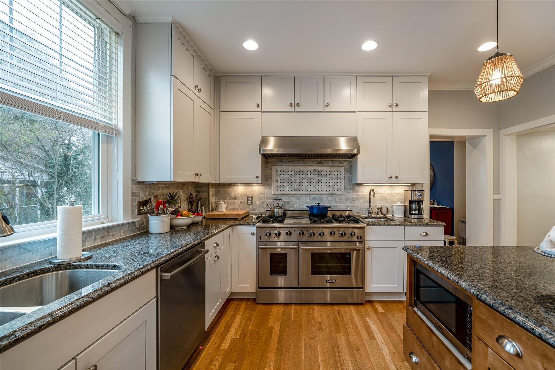 400 High Street Salem, VA 24153 - Photo 24 of 67 a kitchen with stainless steel appliances granite countertop a sink a stove and a wooden floors