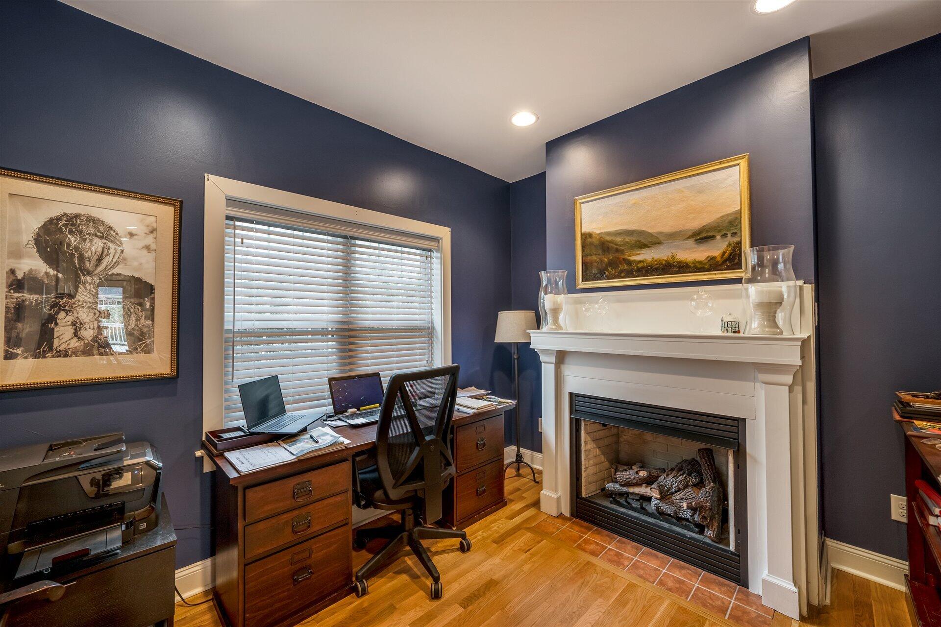 400 High Street Salem, VA 24153 - Photo 25 of 67 a living room with furniture a flat screen tv and a fireplace
