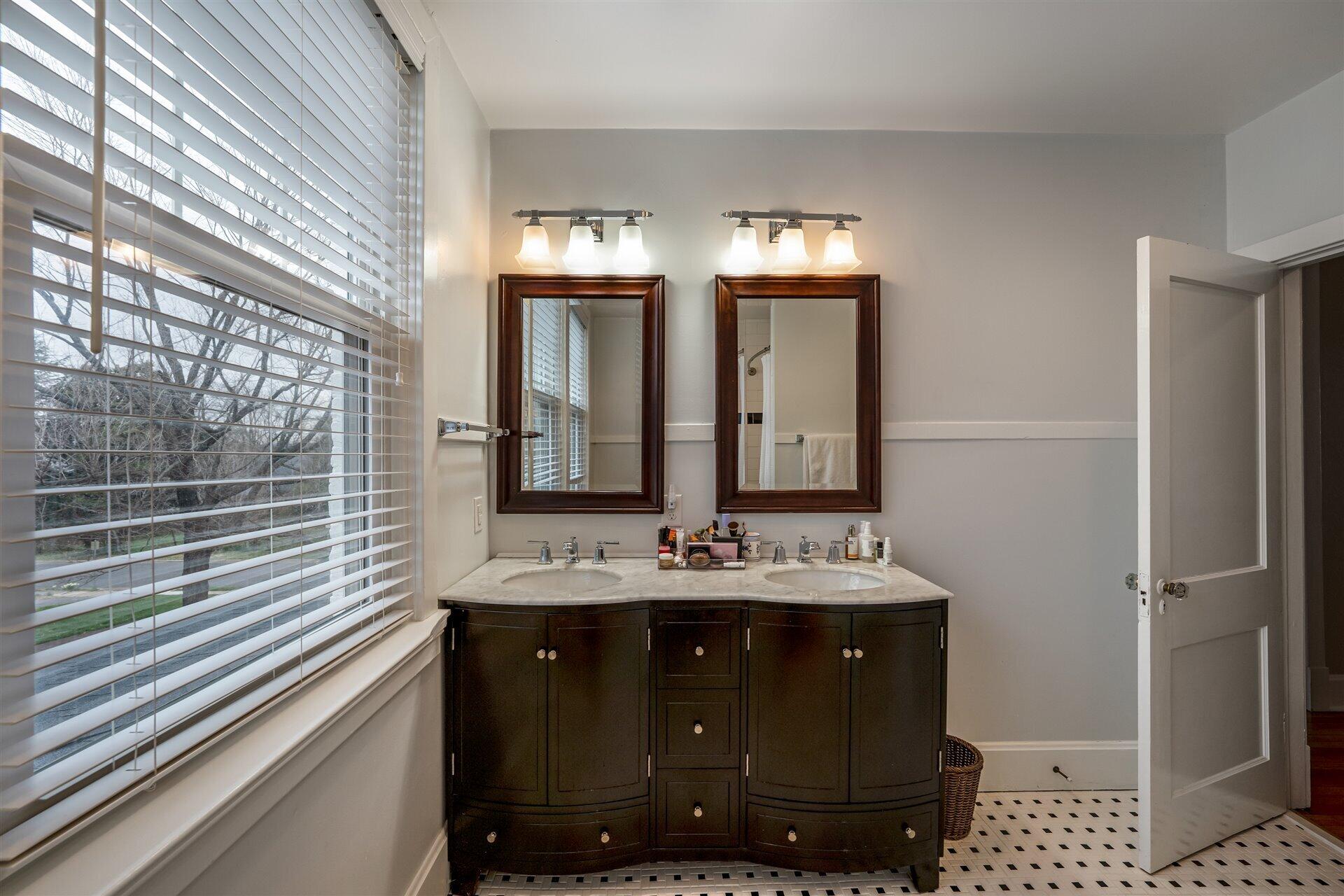 400 High Street Salem, VA 24153 - Photo 40 of 67 a bathroom with a sink a mirror and a shower