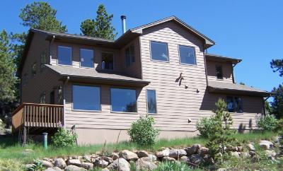 3601 Ridge Road Nederland, CO 80466 - Photo 1 of 1 a front view of a house with a garden