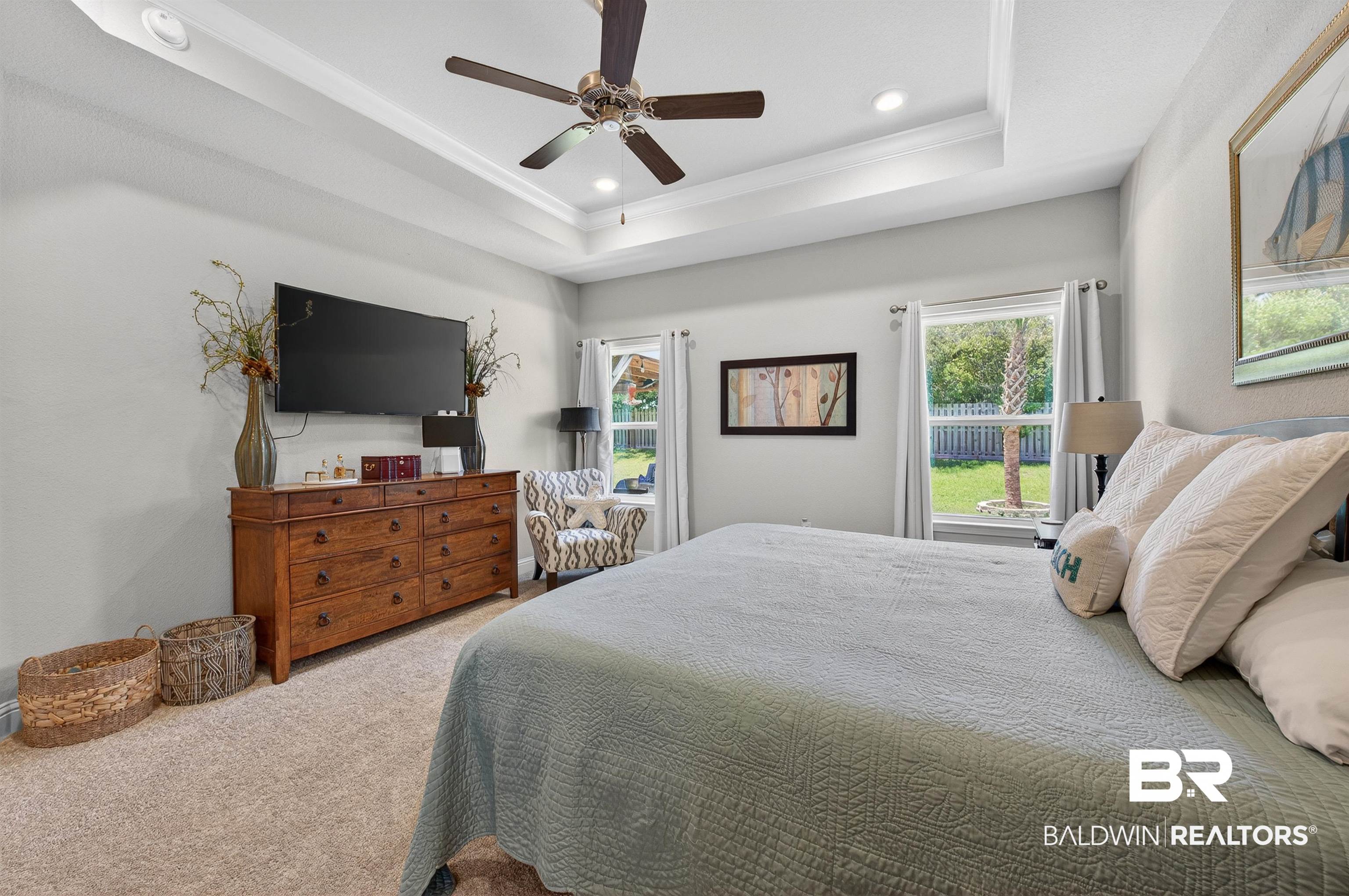 8735 Bronze Lane Foley, AL 36535 - Photo 21 of 58 Tray ceiling with recessed lighting and a ceiling fan
