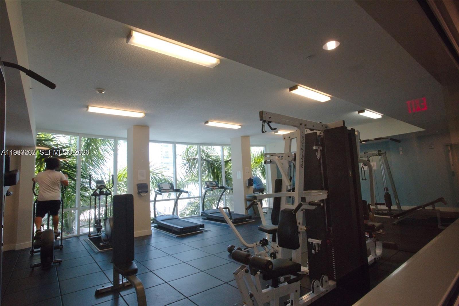 601 Northeast 23rd Street, Unit 1004 Miami, FL 33137 - Photo 14 of 17 a view of a room with gym equipment