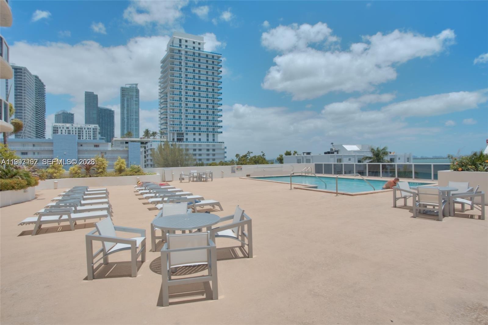 601 Northeast 23rd Street, Unit 1004 Miami, FL 33137 - Photo 15 of 17 a view of swimming pool outdoor seating and city view