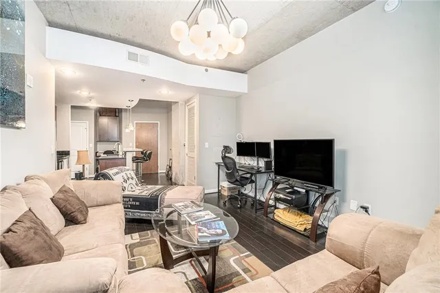 a living room with furniture and a flat screen tv