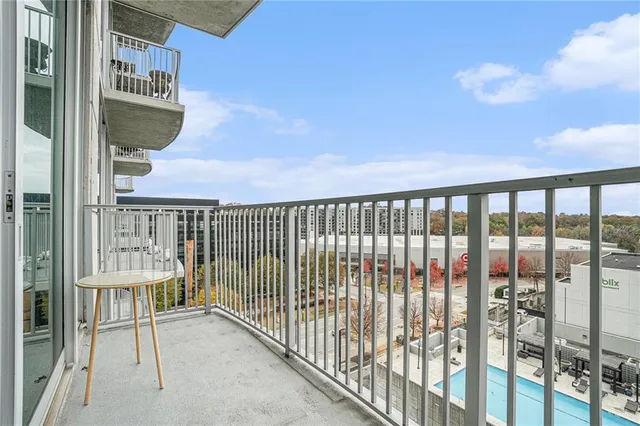 a view of a balcony with furniture