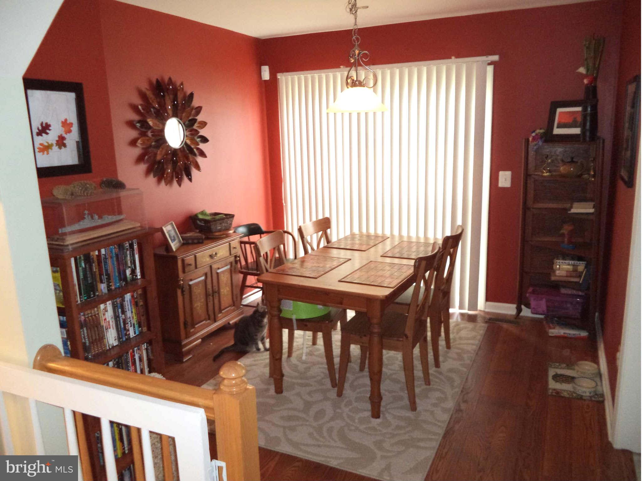1335 Steed Street Ranson, WV 25438 - Photo 5 of 17 a view of a dining room with furniture and wooden floor