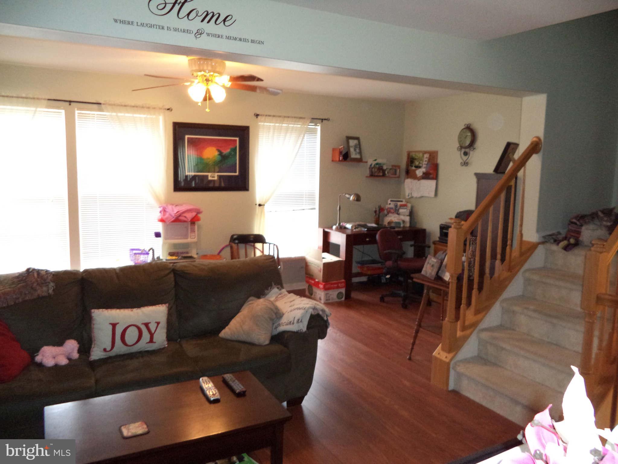 1335 Steed Street Ranson, WV 25438 - Photo 7 of 17 a living room with furniture and a flat screen tv