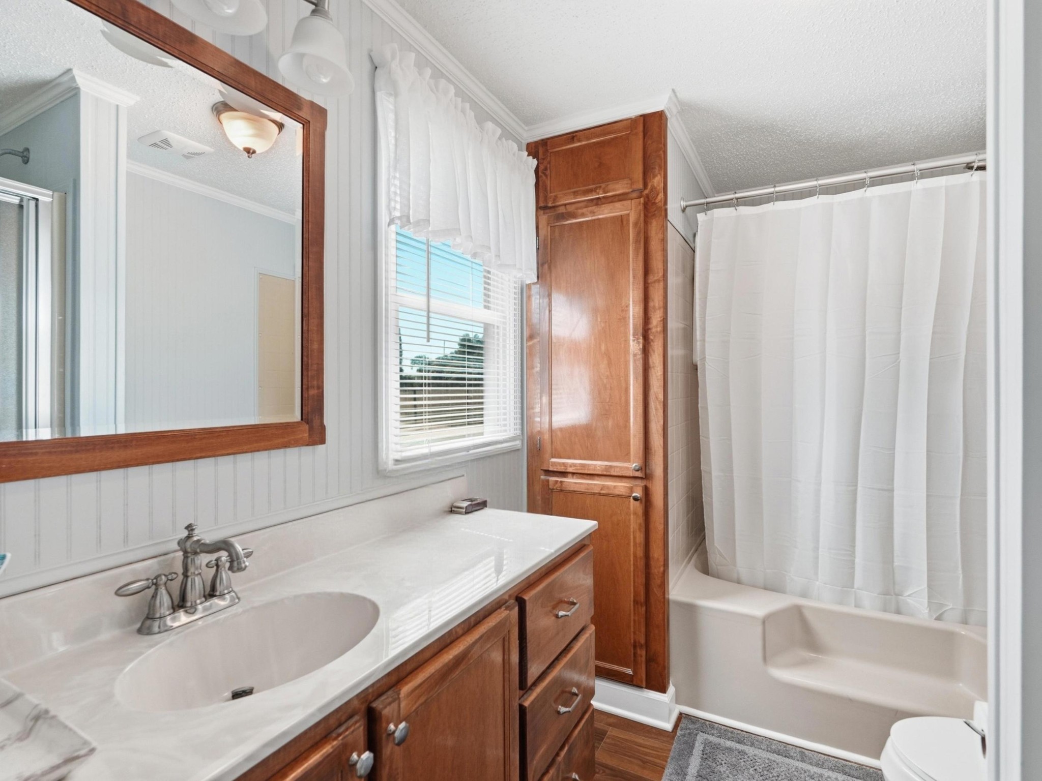 597 Hiwassee Road Lebanon, TN 37087 - Photo 25 of 37 a bathroom with a sink and a mirror