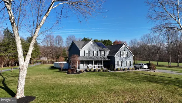 a view of a house with a big yard