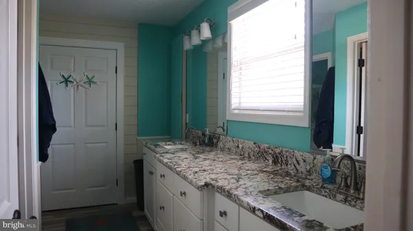 a bedroom with bed and window