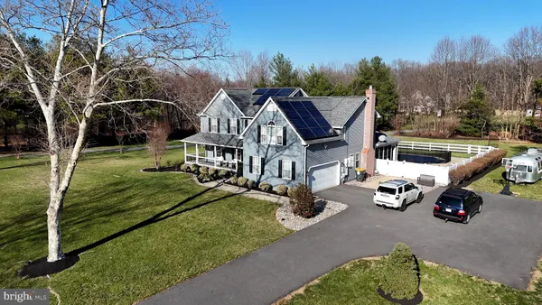 a view of a house with backyard