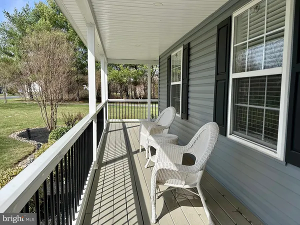 a view of a chairs and table in a backyard
