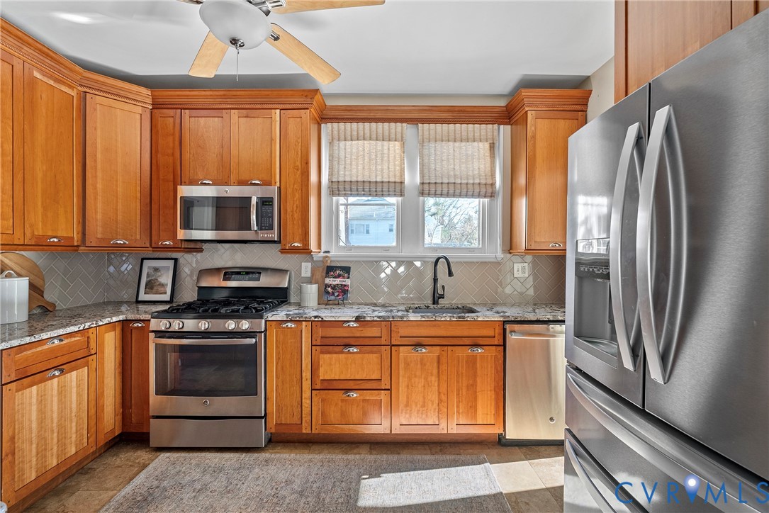 2517 Hilliard Road Henrico, VA 23228 - Photo 21 of 47 a kitchen with stainless steel appliances granite countertop a stove a sink dishwasher a refrigerator and a microwave