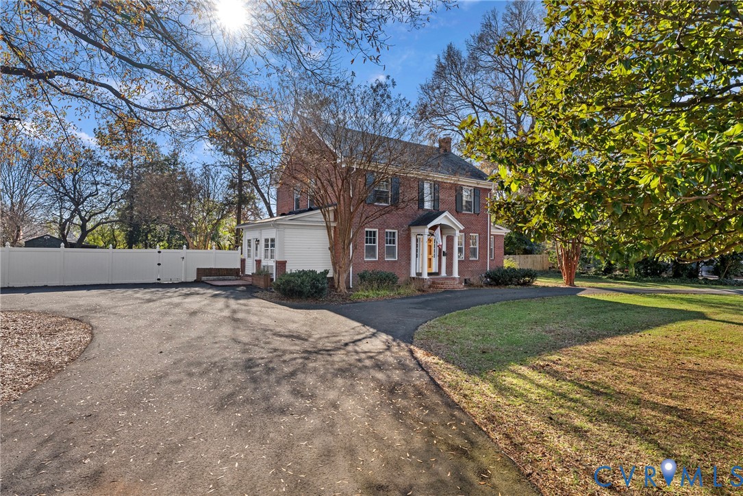 2517 Hilliard Road Henrico, VA 23228 - Photo 3 of 47 a view of a house next to a yard with big trees