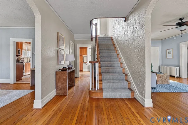a living room with furniture a fireplace and a window