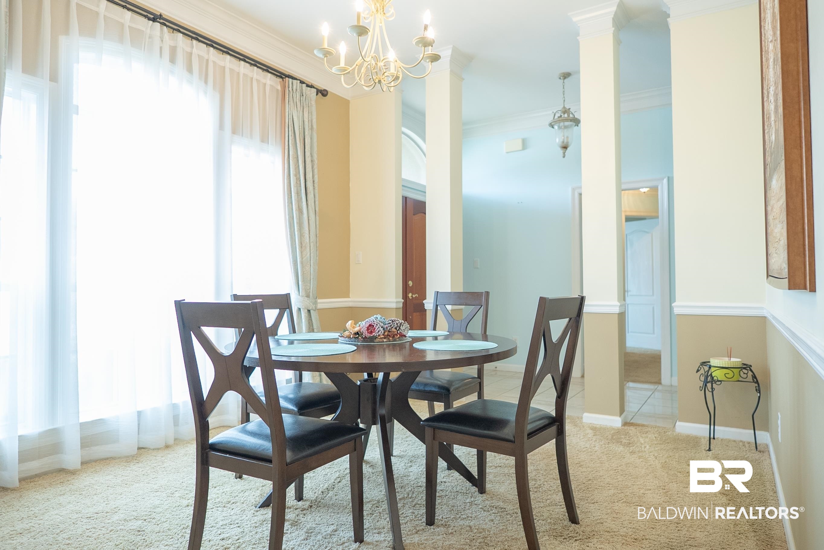 10023 Springfield Court Mobile, AL 36695 - Photo 9 of 50 Dining area featuring carpet, ornamental molding, and a chandelier